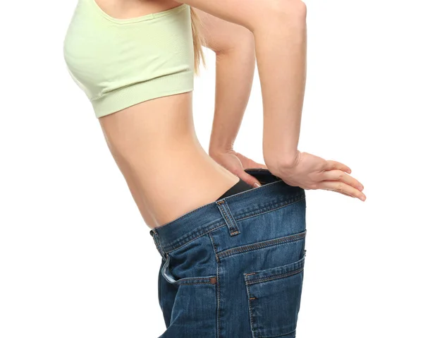 Woman in large jeans — Stock Photo, Image