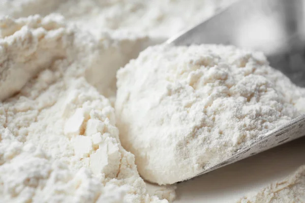 Metal scoop in flour — Stock Photo, Image