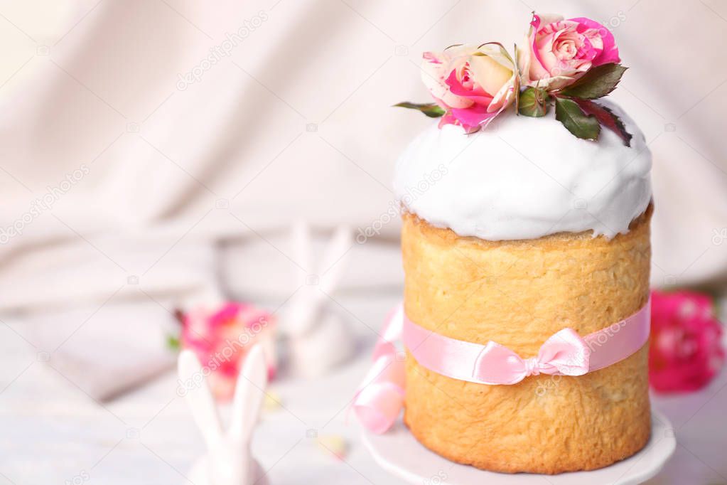 Easter cake decorated with flowers on ceramic stand