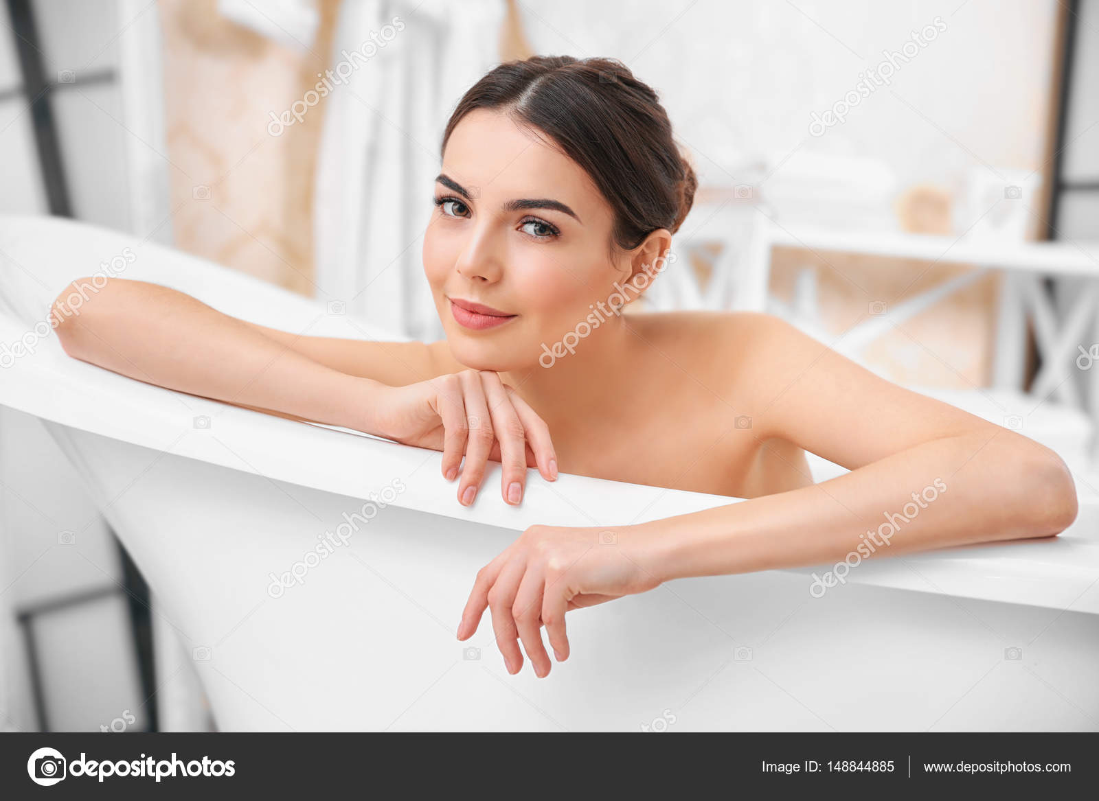 Young woman taking bath Stock Photo by ©belchonock 148844885