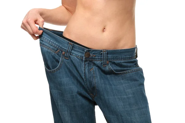 Woman in large jeans — Stock Photo, Image