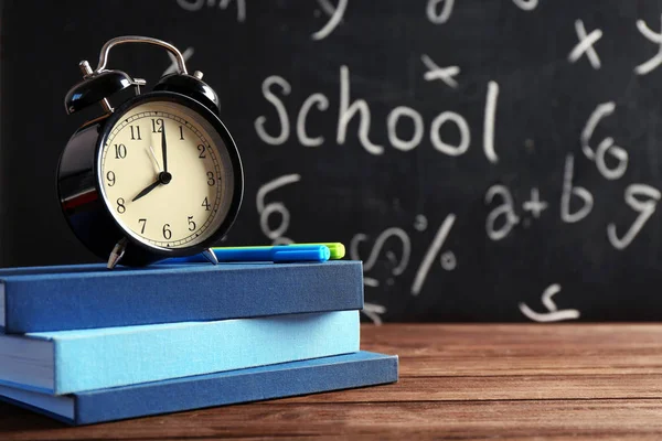 Books and alarm clock — Stock Photo, Image