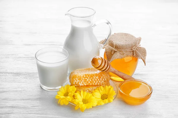 Composition of jar with milk and honey — Stock Photo, Image