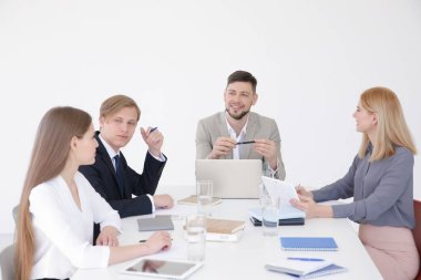 Business trainer giving presentation to group of people clipart