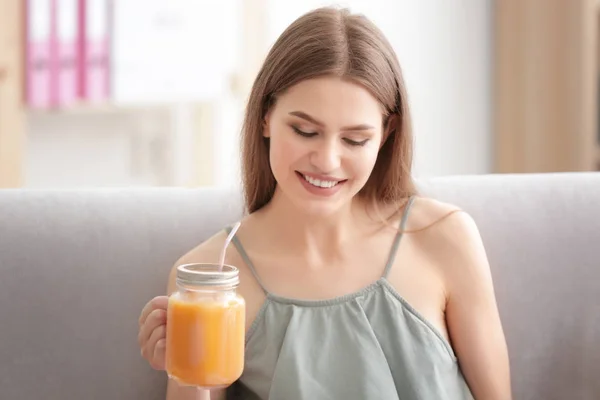 Young woman tasting fresh juice — Stock Photo, Image