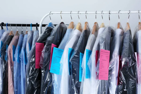 Rack of clean clothes on hangers — Stock Photo, Image