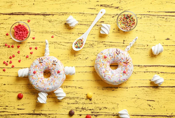 Decorated donuts on table — Stock Photo, Image