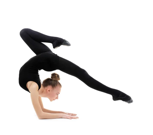 Chica joven haciendo gimnasia sobre fondo blanco —  Fotos de Stock