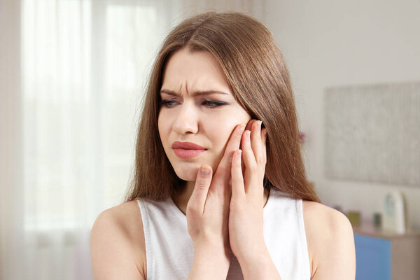 woman suffering from toothache 
