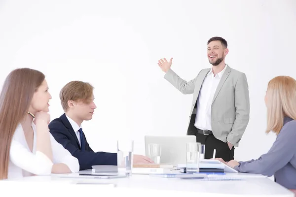 Business trainer giving presentation to group of people Stock Photo