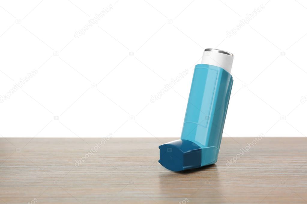 Asthma inhaler on table
