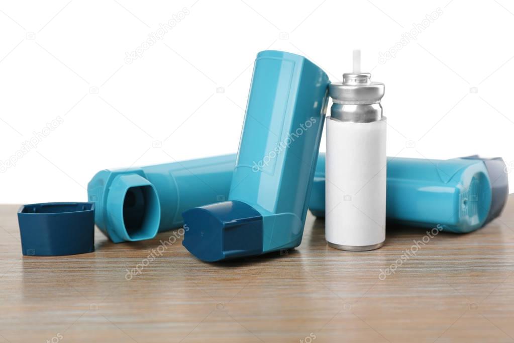 Asthma inhalers on table