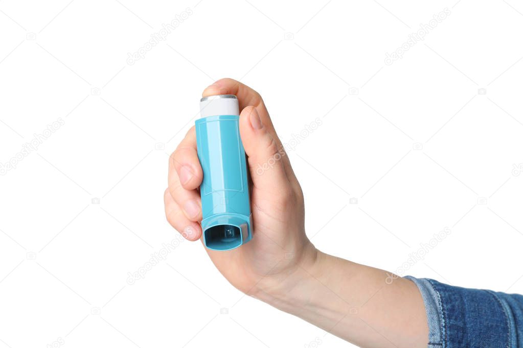 hand holding asthma inhaler 