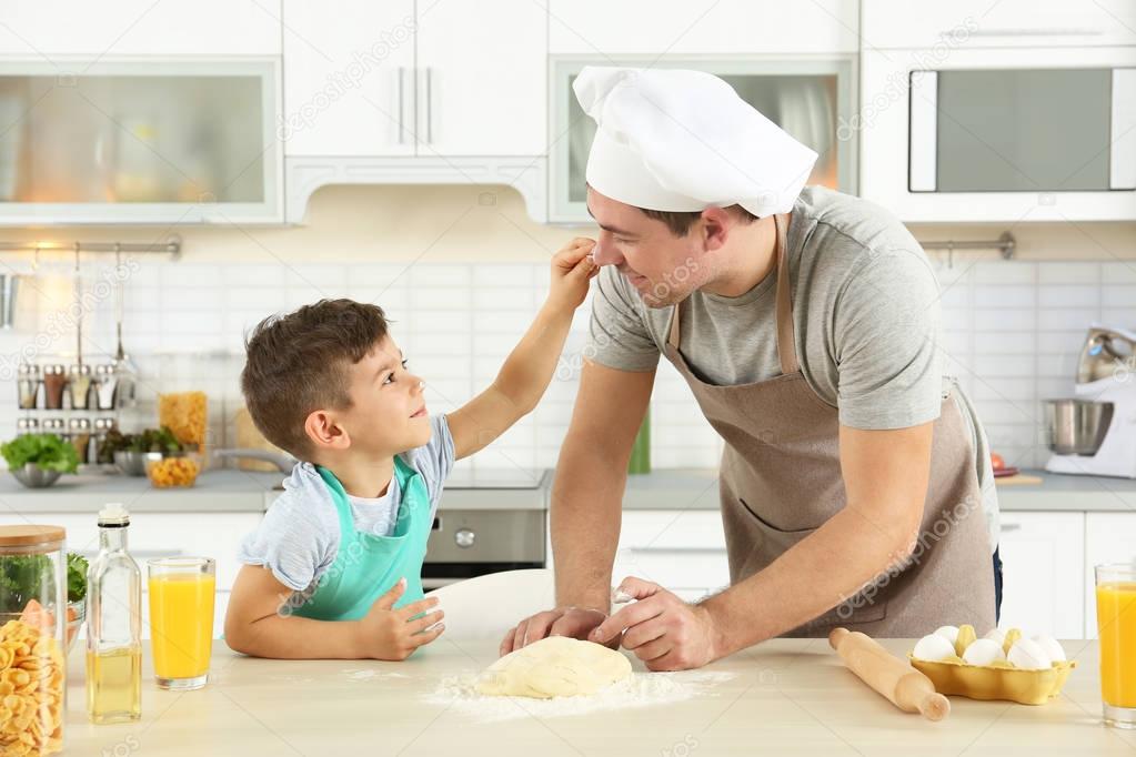 Father and son cooking
