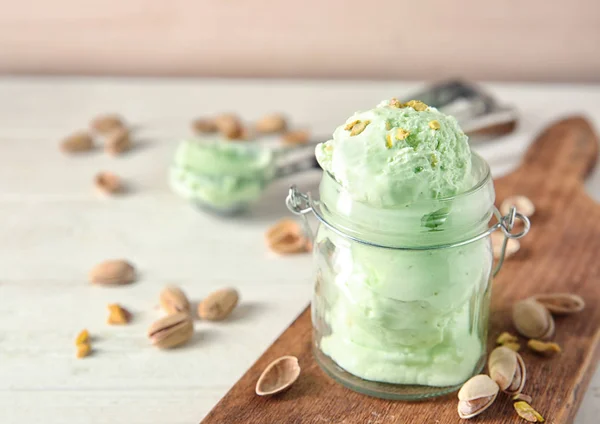 Tasty pistachio ice cream in jar — Stock Photo, Image