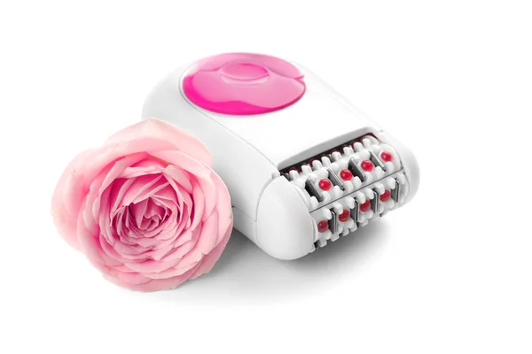 Modern epilator and flower — Stock Photo, Image