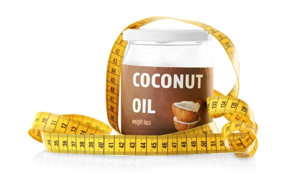 Coconut oil and measuring tape — Stock Photo, Image