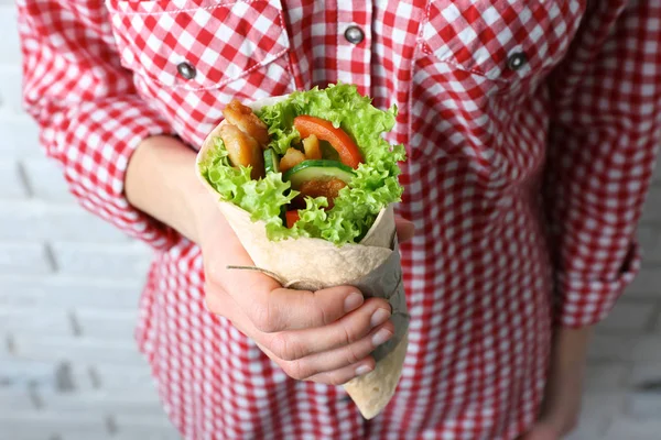 Woman holding kebab roll — Stock Photo, Image