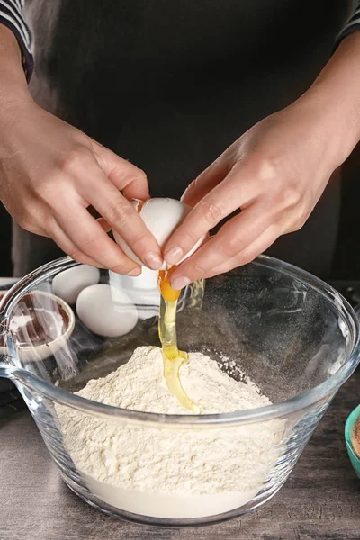 Woman preparing dough for brownies