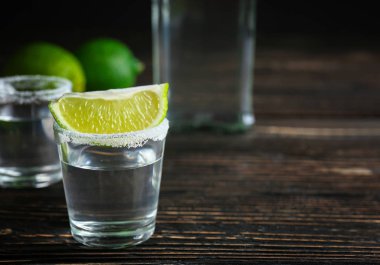 Tequila shot with lime slice clipart
