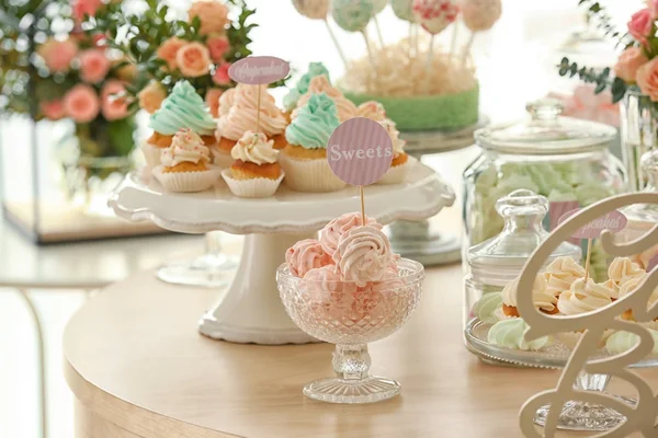 Table with tasty sweets — Stock Photo, Image