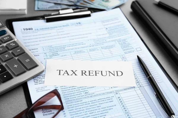 Paper sheet with text TAX REFUND