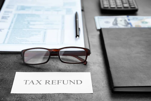 Paper sheet with text TAX REFUND — Stock Photo, Image