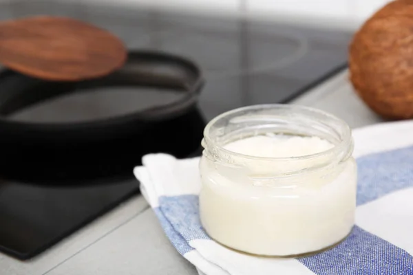 Jar with coconut oil — Stock Photo, Image