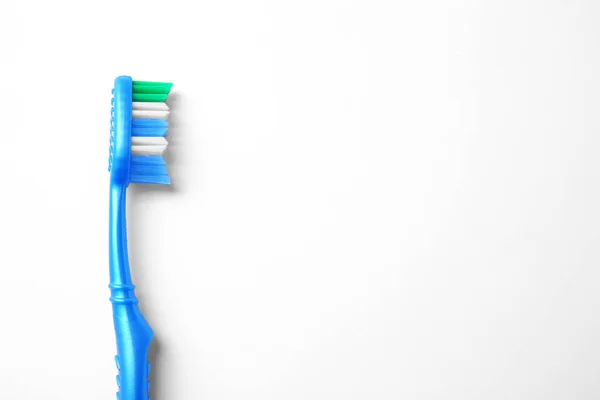 New toothbrush on white — Stock Photo, Image