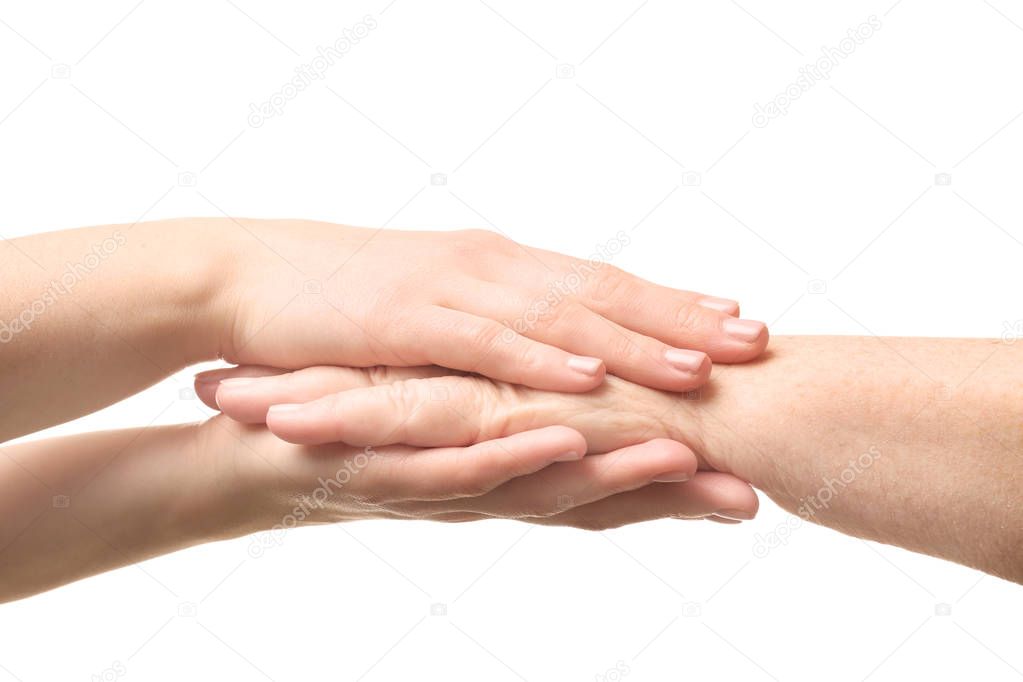 Old and young women holding hands