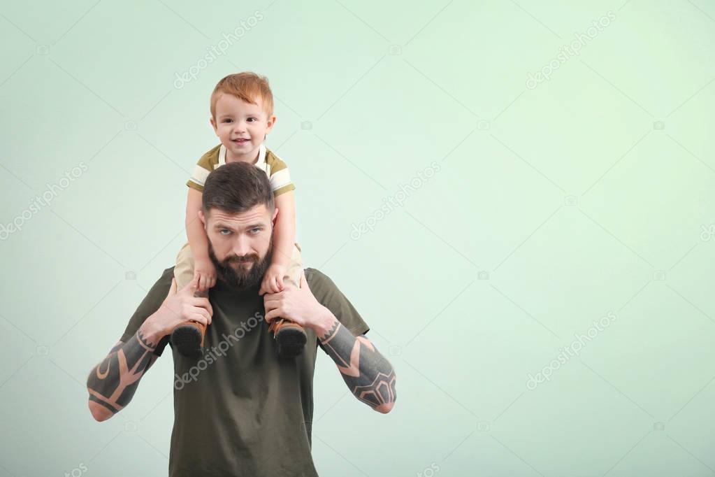 young man holding little boy