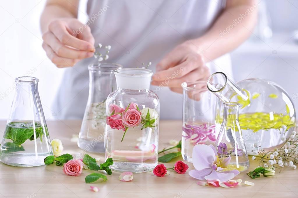 Woman mixing perfume samples