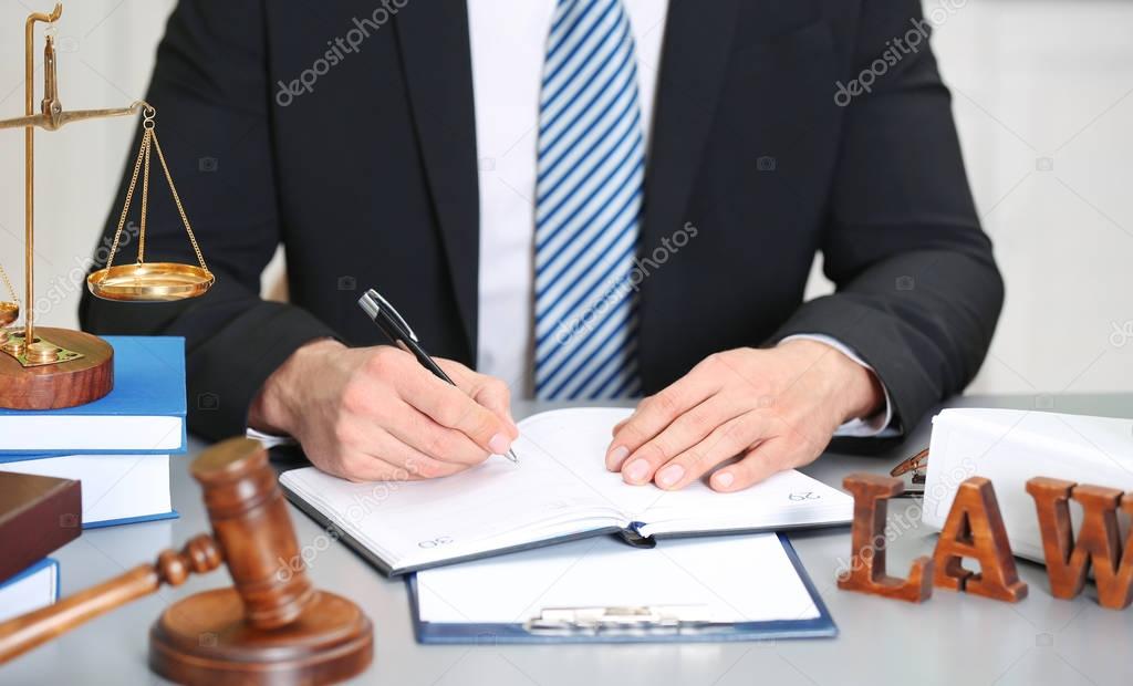 Male judge working with document