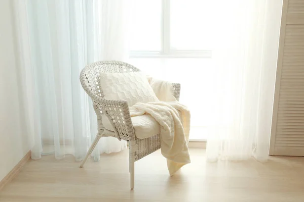 Comfortable wicker arm-chair — Stock Photo, Image