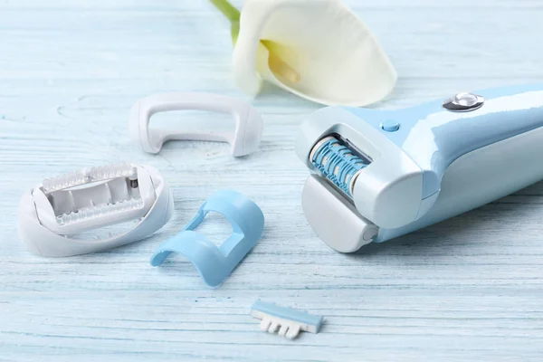 Modern epilator with accessories — Stock Photo, Image