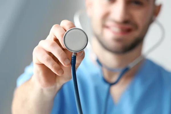 Young medical assistant with stethoscope