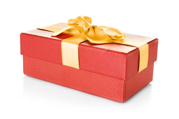 Red gift box with golden ribbon — Stock Photo, Image