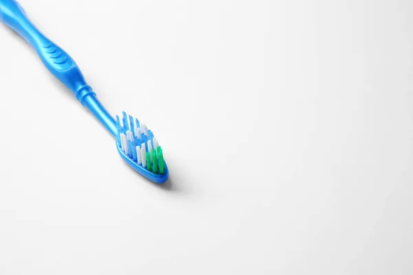 New toothbrush on white — Stock Photo, Image