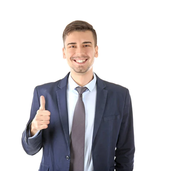 Pohledný muž v elegantním obleku ukazuje palcem na bílém pozadí — Stock fotografie