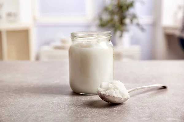Jar with coconut oil — Stock Photo, Image