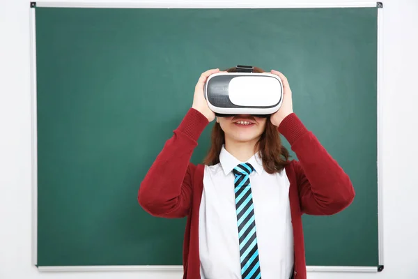 Schoolgirl with virtual reality glasses