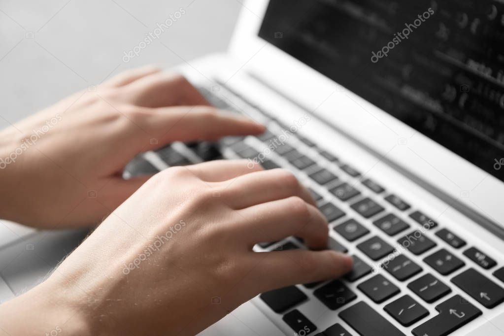 Programmer using laptop