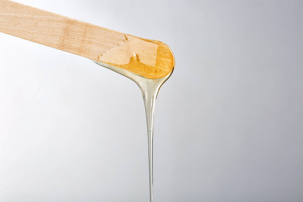 Wooden stick with sugaring paste 