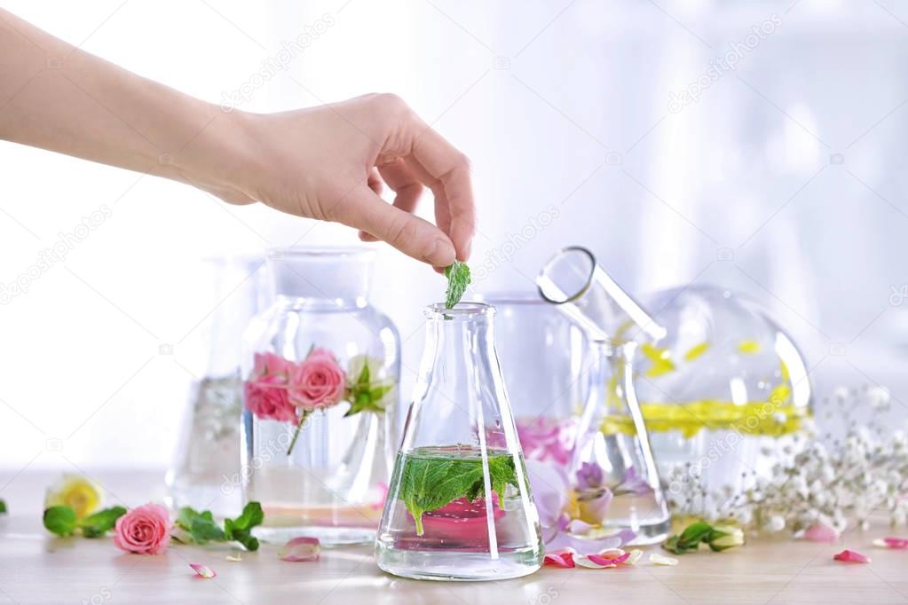 Woman mixing perfume samples