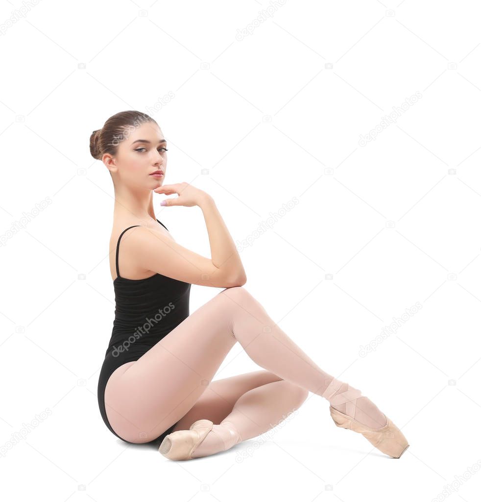 Young beautiful ballerina sitting