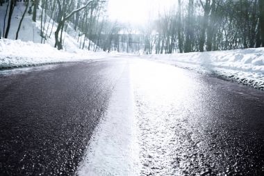Winter road outside city clipart