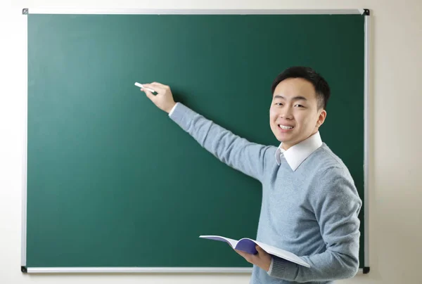 Handsome Asian teacher — Stock Photo, Image