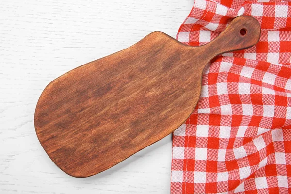 Red napkin and cutting board — Stock Photo, Image