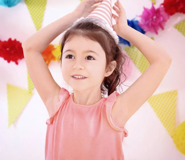 Cute little girl celebrating birthday at party — Stock Photo, Image