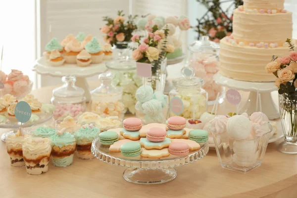 Table with tasty sweets — Stock Photo, Image